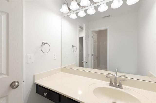 bathroom featuring visible vents and vanity