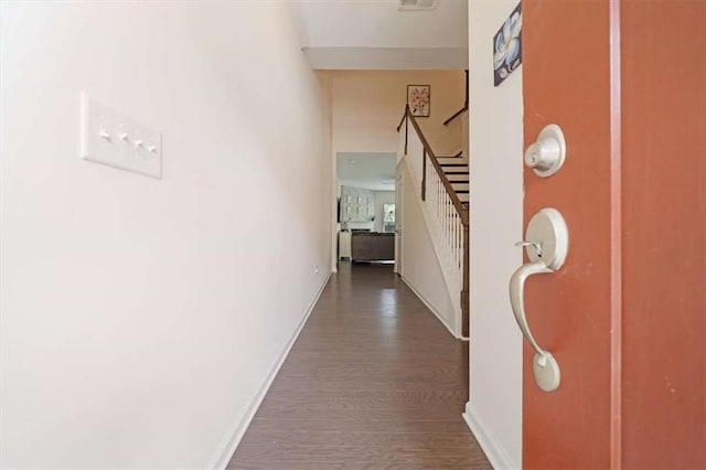 hallway featuring dark hardwood / wood-style flooring