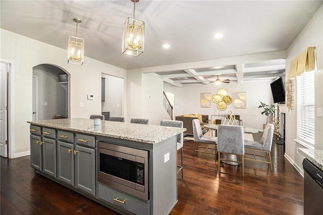 6213 Old Kingston Dr, Atlanta, GA 30331 - kitchen with appliances with stainless steel finishes, arched walkways, dark wood finished floors, beamed ceiling, and coffered ceiling