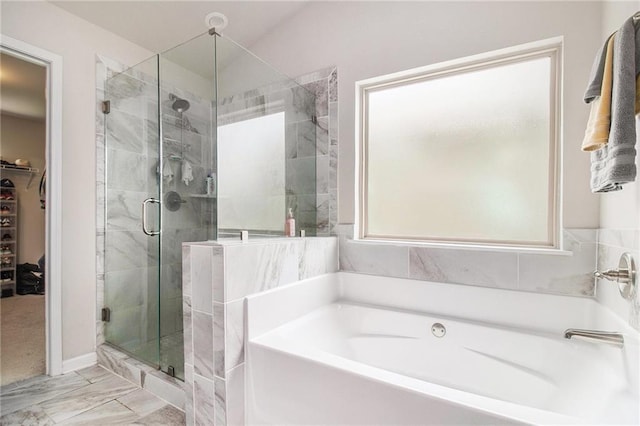 6213 Old Kingston Dr, Atlanta, GA 30331 - full bathroom with a bath, a shower stall, a spacious closet, and marble look tiles