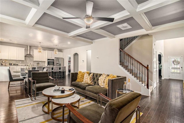 6213 Old Kingston Dr, Atlanta, GA 30331 - living area featuring coffered ceiling, ceiling fan, dark wood finished floors, arched walkways, and beamed ceiling