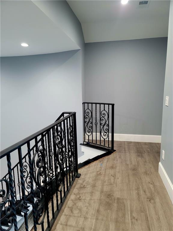 hallway with wood-type flooring