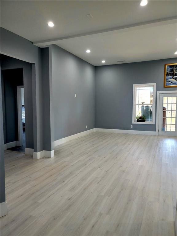 unfurnished room with light hardwood / wood-style floors