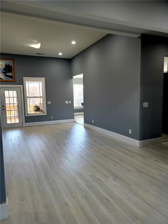 spare room featuring light hardwood / wood-style floors