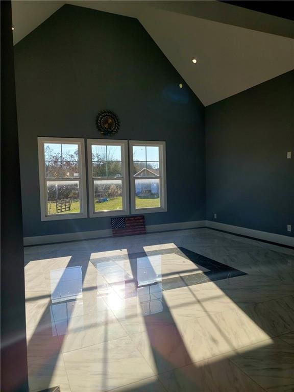 interior space with a wealth of natural light and high vaulted ceiling