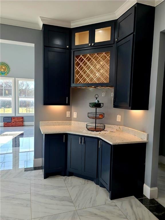 bar with ornamental molding, light tile patterned floors, and light stone countertops