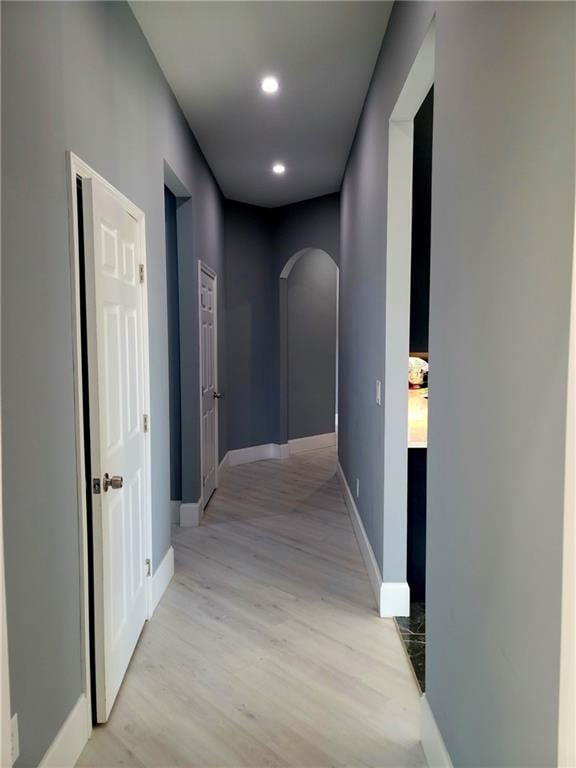 hallway with wood-type flooring