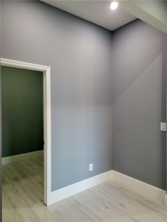 empty room featuring wood-type flooring