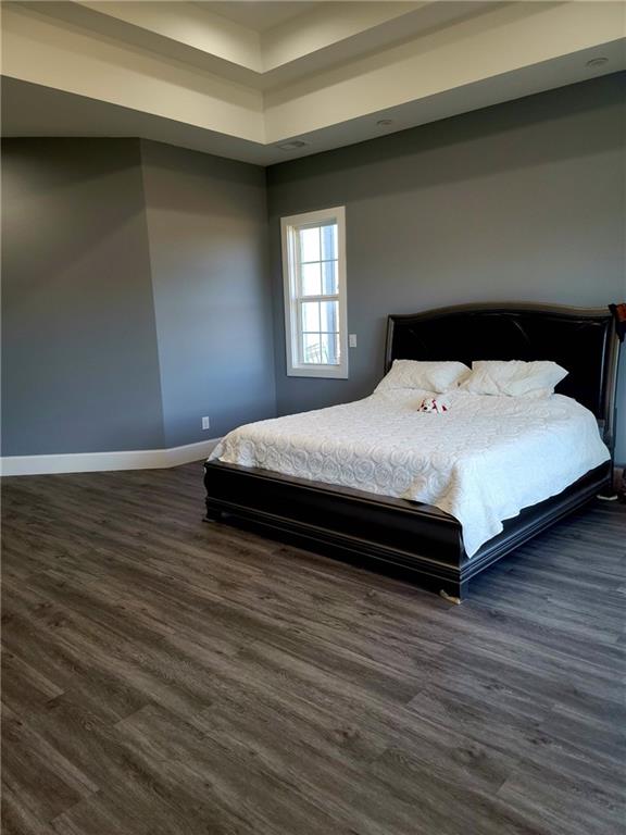 bedroom featuring dark hardwood / wood-style flooring