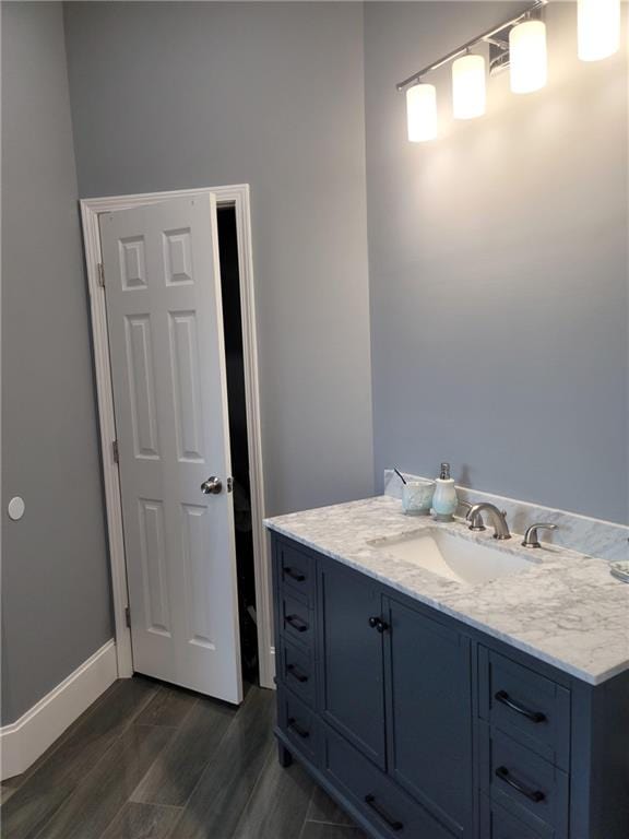 bathroom with vanity and hardwood / wood-style floors