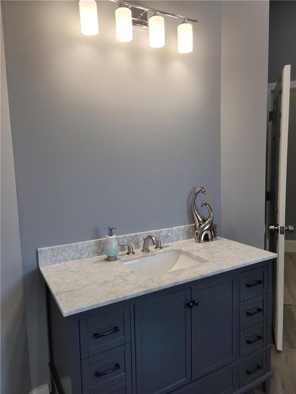 bathroom with wood-type flooring and vanity