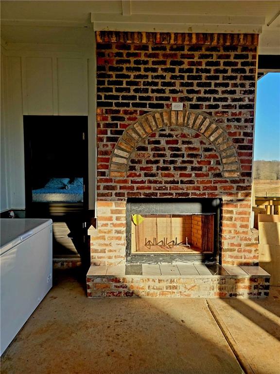 interior space featuring brick wall