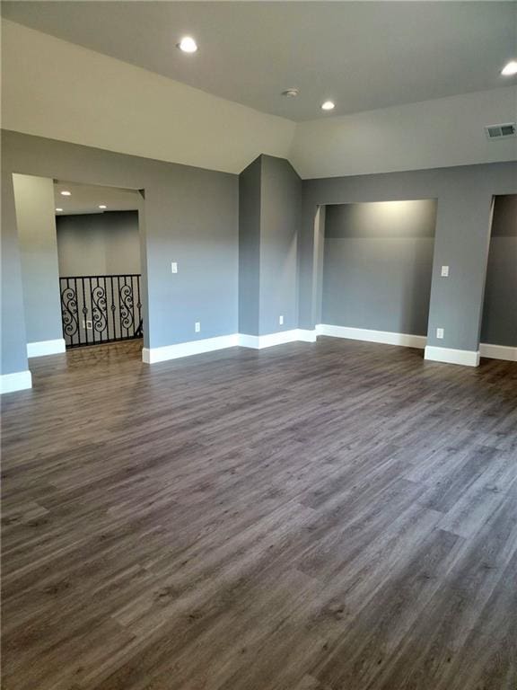 unfurnished room featuring dark wood-type flooring