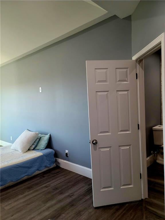 bedroom featuring dark hardwood / wood-style flooring