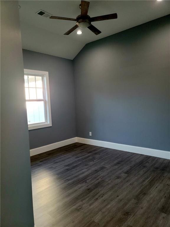 spare room with vaulted ceiling, ceiling fan, and hardwood / wood-style floors