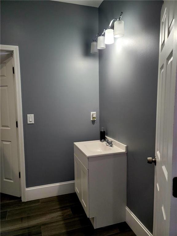 bathroom featuring vanity and hardwood / wood-style flooring