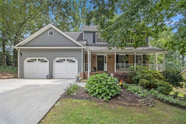 110 Windsor Chase Dr, Lawrenceville, GA 30043 - view of front facade with covered porch, an attached garage, driveway, and brick siding