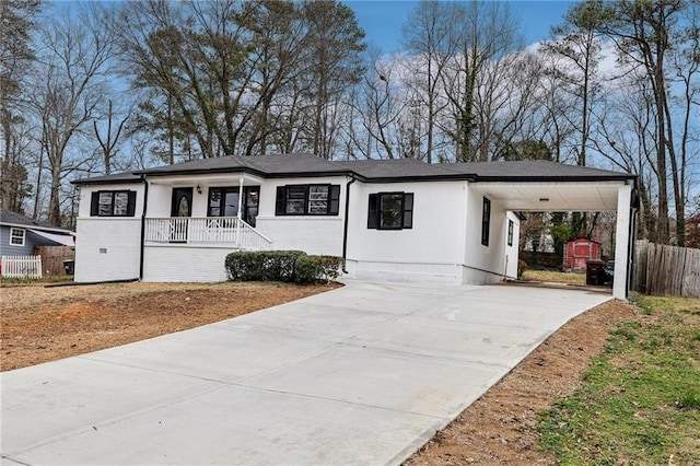 view of front of house with a carport and covered porch