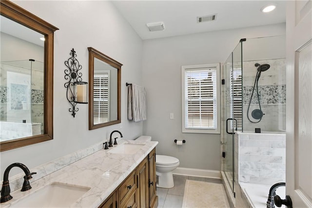 full bathroom with a stall shower, a sink, visible vents, and baseboards