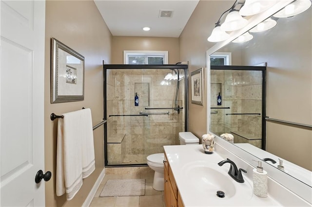 bathroom with vanity, tile patterned flooring, a shower stall, and visible vents