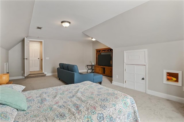 bedroom with baseboards, visible vents, vaulted ceiling, and carpet flooring