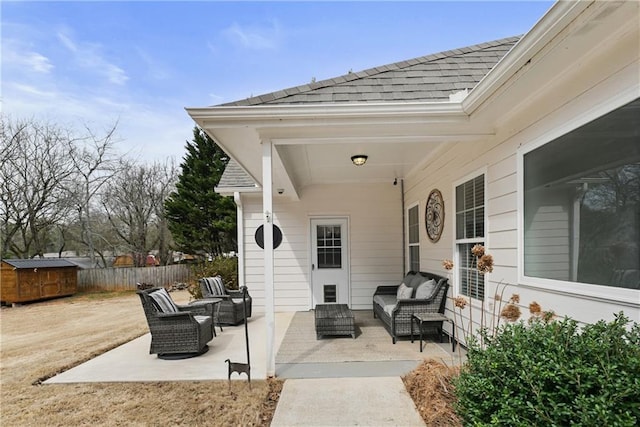 view of patio / terrace with fence and an outdoor living space