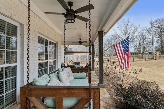 view of patio with ceiling fan, fence, and an outdoor hangout area