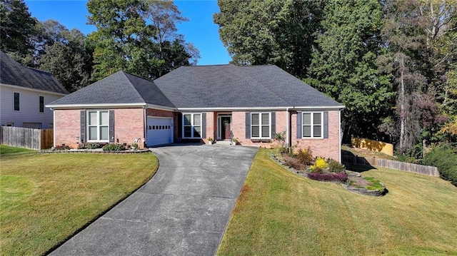 view of front facade featuring a front lawn and a garage