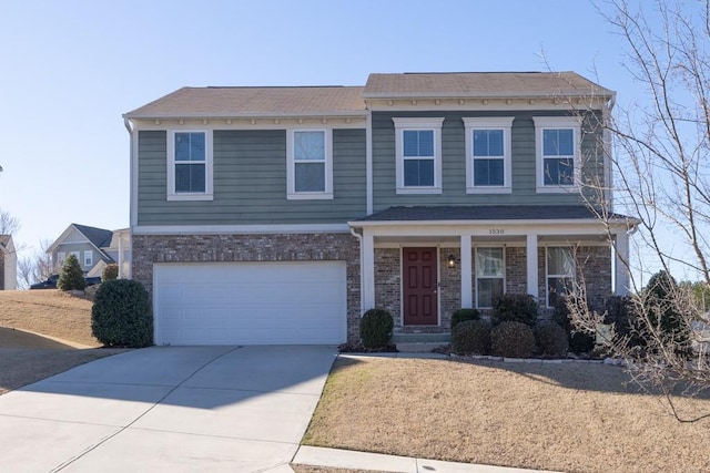 view of front of house featuring driveway, a garage, a porch, and brick siding