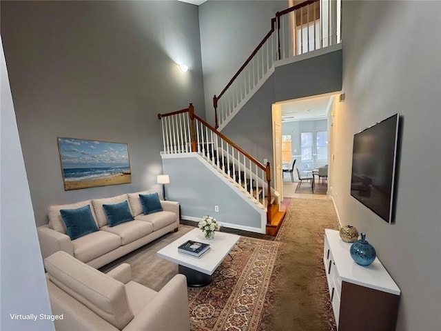 living room featuring a towering ceiling