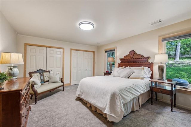 1959 Grand Prix Dr NE, Atlanta, GA 30345 - carpeted bedroom with two closets and baseboards