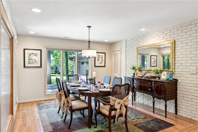 1959 Grand Prix Dr NE, Atlanta, GA 30345 - dining space featuring brick wall, light wood-type flooring, recessed lighting, and baseboards