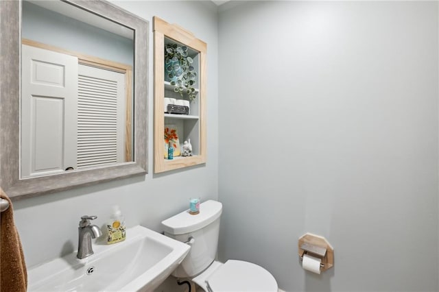 1959 Grand Prix Dr NE, Atlanta, GA 30345 - half bathroom featuring a sink and toilet