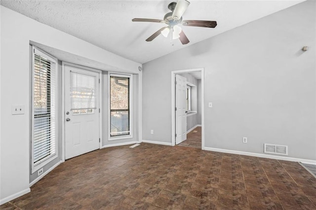 entryway featuring vaulted ceiling and ceiling fan