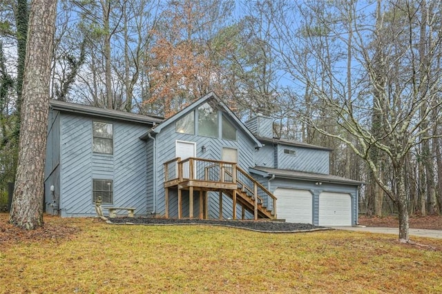 view of front of home with a garage and a front yard