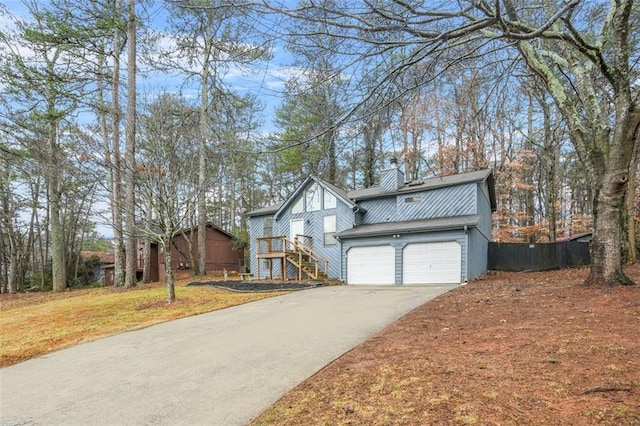 view of front facade with a garage and a front lawn