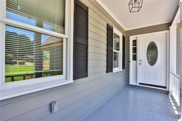 entrance to property with covered porch