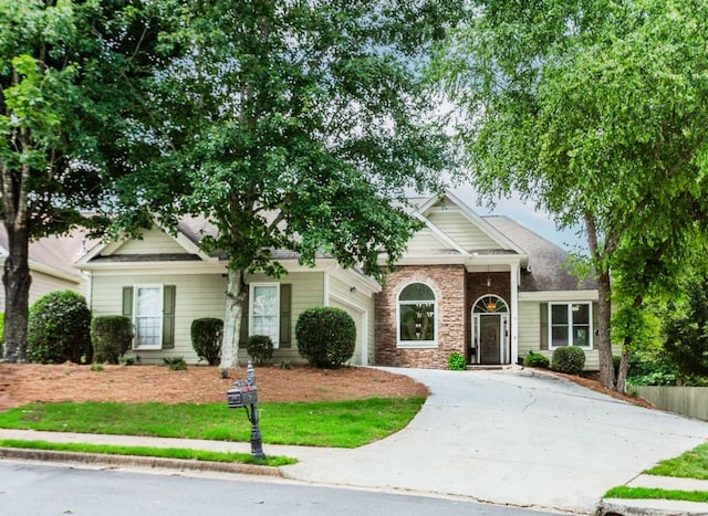 1122 Cayuga Ct, Dacula, GA 30019 - view of front of house featuring a garage, concrete driveway, and stone siding