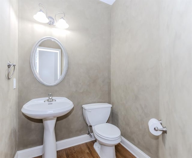 1122 Cayuga Ct, Dacula, GA 30019 - bathroom featuring wood finished floors and toilet