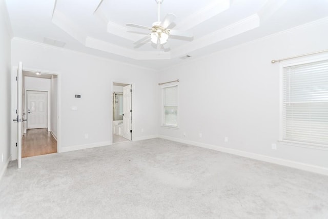 1122 Cayuga Ct, Dacula, GA 30019 - unfurnished bedroom featuring ornamental molding, carpet flooring, a raised ceiling, ensuite bathroom, and ceiling fan