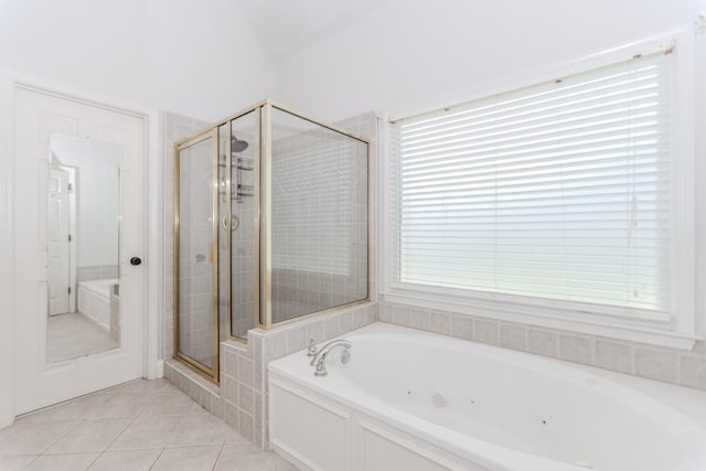 1122 Cayuga Ct, Dacula, GA 30019 - bathroom featuring a jetted tub, a stall shower, tile patterned floors, plenty of natural light, and vaulted ceiling