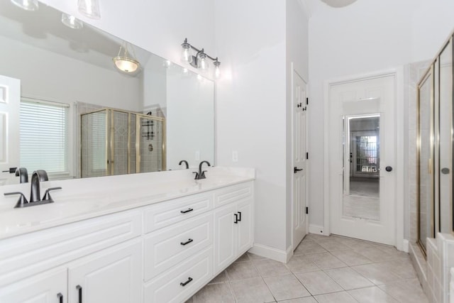 1122 Cayuga Ct, Dacula, GA 30019 - bathroom with double vanity, a shower stall, and tile patterned flooring