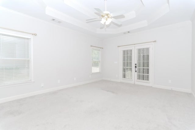 1122 Cayuga Ct, Dacula, GA 30019 - empty room with ornamental molding, french doors, a tray ceiling, carpet floors, and ceiling fan