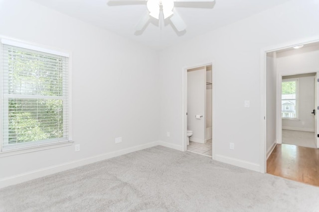 1122 Cayuga Ct, Dacula, GA 30019 - unfurnished bedroom with carpet flooring, ensuite bathroom, and a ceiling fan