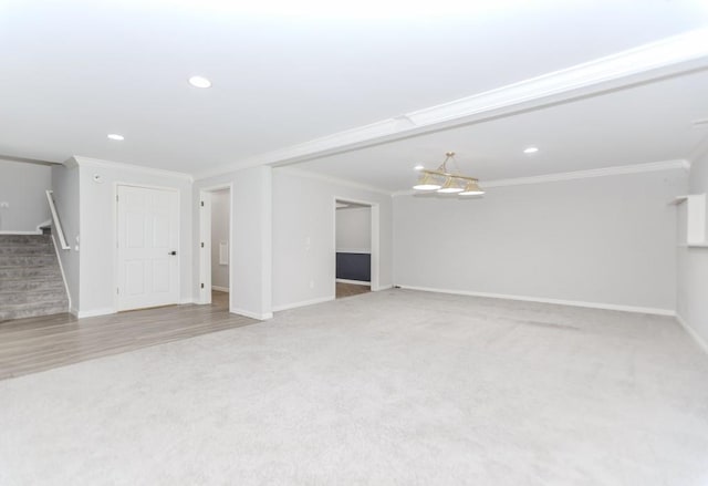 1122 Cayuga Ct, Dacula, GA 30019 - unfurnished living room featuring carpet, stairway, ornamental molding, recessed lighting, and a chandelier
