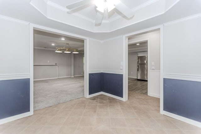 1122 Cayuga Ct, Dacula, GA 30019 - tiled spare room with a ceiling fan, carpet floors, crown molding, and a tray ceiling