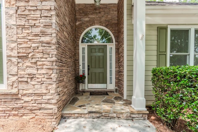 1122 Cayuga Ct, Dacula, GA 30019 - doorway to property with covered porch and brick siding