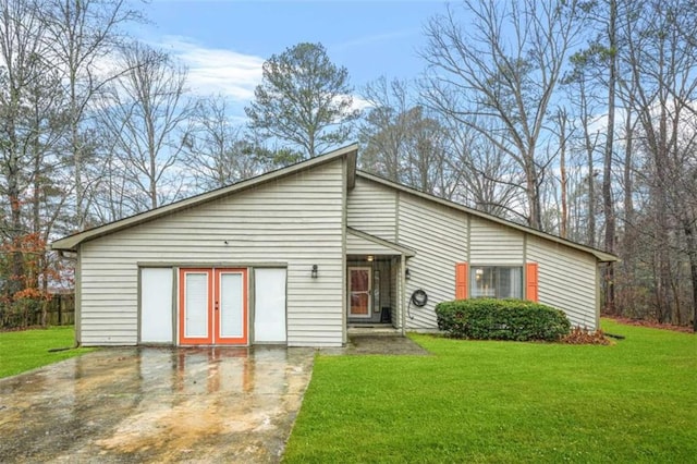 view of front of house featuring french doors and a front lawn