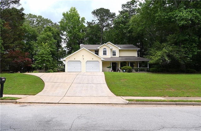 9130 Charlton Pl, Douglasville, GA 30135 - view of front of property with driveway, a porch, a garage, and a front lawn