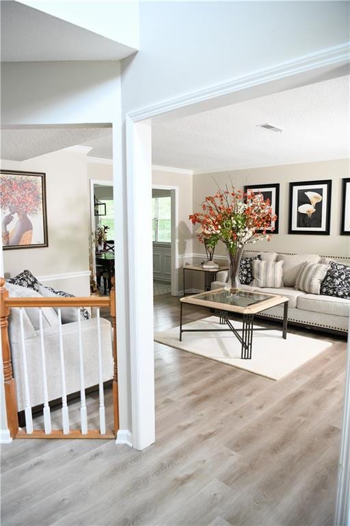 9130 Charlton Pl, Douglasville, GA 30135 - living area featuring wood finished floors and crown molding